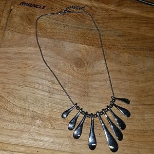 Sterling silver necklace with beads and dangles.